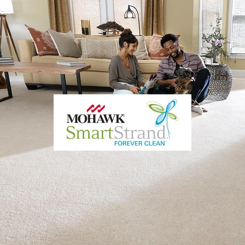 Mohawk carpet and flooring display showcasing various textures and colors in a well-lit showroom setting.