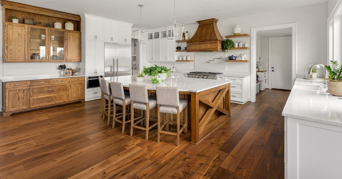 A cozy living room featuring wooden floors, a warm fireplace, and comfortable seating arrangements.