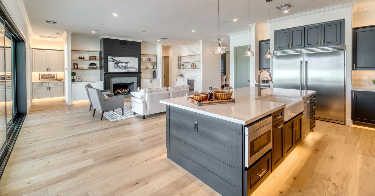 A spacious kitchen featuring a central island and a large countertop area for cooking and dining.