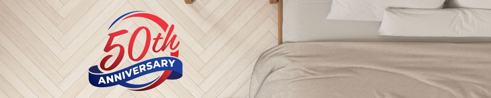 A modern living room featuring a stylish couch, a coffee table, and a television against a neutral backdrop.