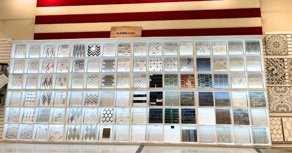 A display of tiles and products in front of an American flag, showcasing a variety of colors and textures.