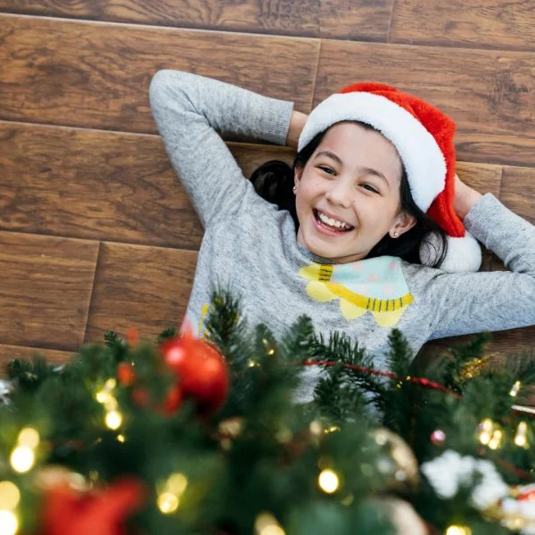 smiling child under christmas tree