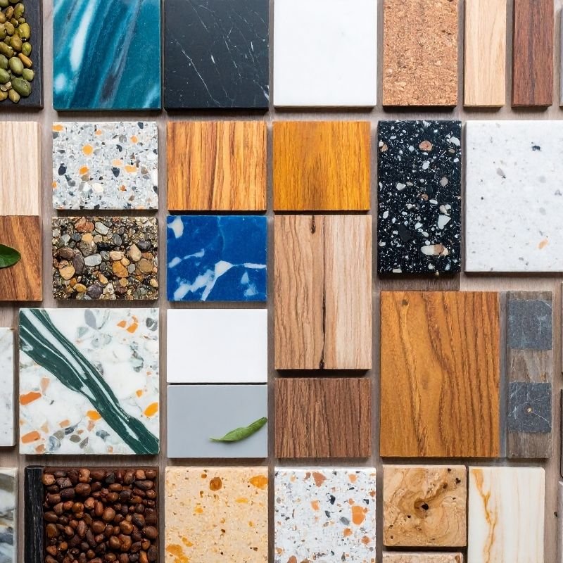 A collection of various wood and stone tiles arranged to showcase different textures and colors.