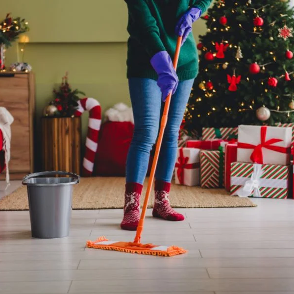 lady cleaning floor during the holidays