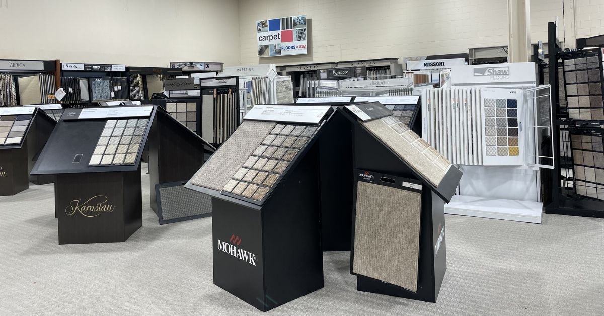 Floors USA showroom showcasing an array of carpet samples in different colors and textures for customers to explore.