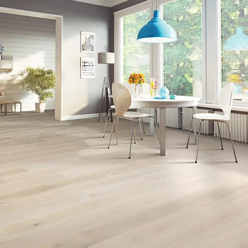Hardwood flooring in bright and cheerful dining room